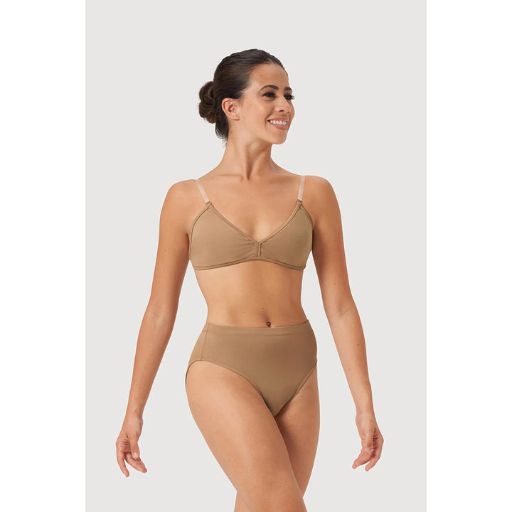 A woman modeling a High Waist Womens Brief undergarment set in a solid tan color, featuring a triangle-style bra top with thin shoulder straps and matching high-waisted bottoms, set against a plain light gray studio background.