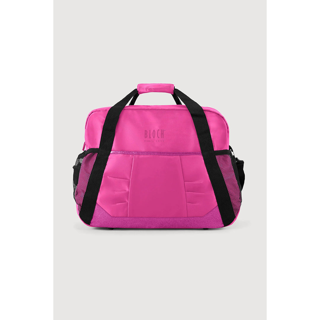 A bright pink duffel bag with black handles and side mesh pockets, featuring the brand name 'BLOOM FITNESS' printed on the front, set against a light gray background.