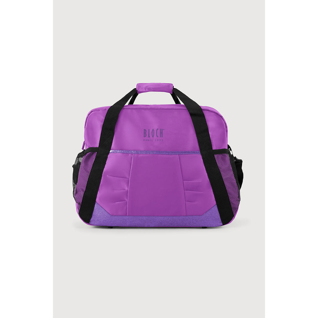 A purple duffel bag with black handles and side straps, featuring a front pocket with the brand name &
