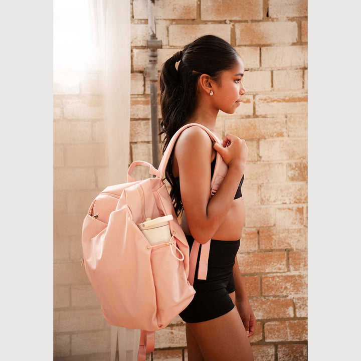 Studio 7 Dancewear Studio Back Pack Blossom Pink worn on shoulder