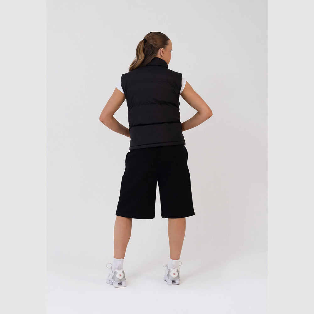 Studio 7 Dancewear Studio Puffer Vest woman wearing, back view