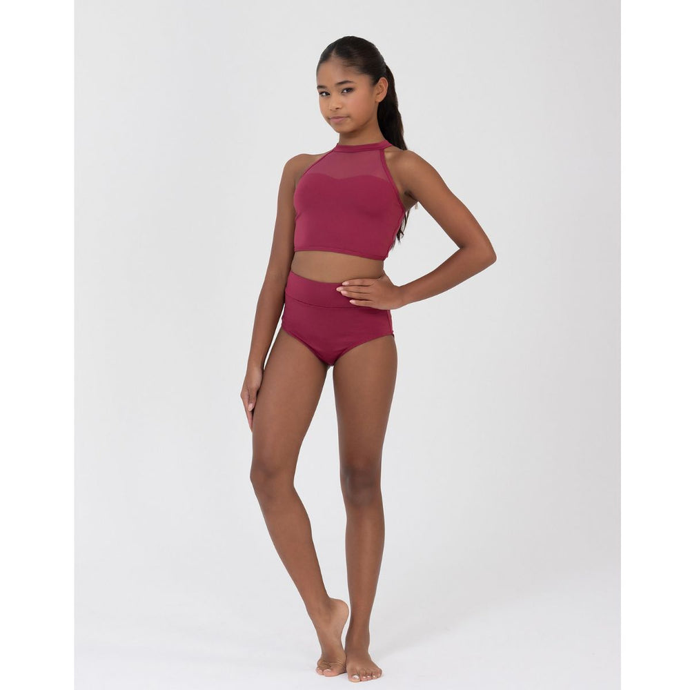 A young girl modeling a two-piece dance or gymnastics leotard set in a deep berry pink. The set features a high-neck crop top with sheer mesh panels and matching high-waisted briefs, photographed against a solid light gray background.